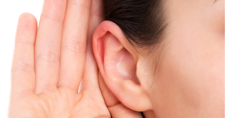 Ear with hand cupped around it.