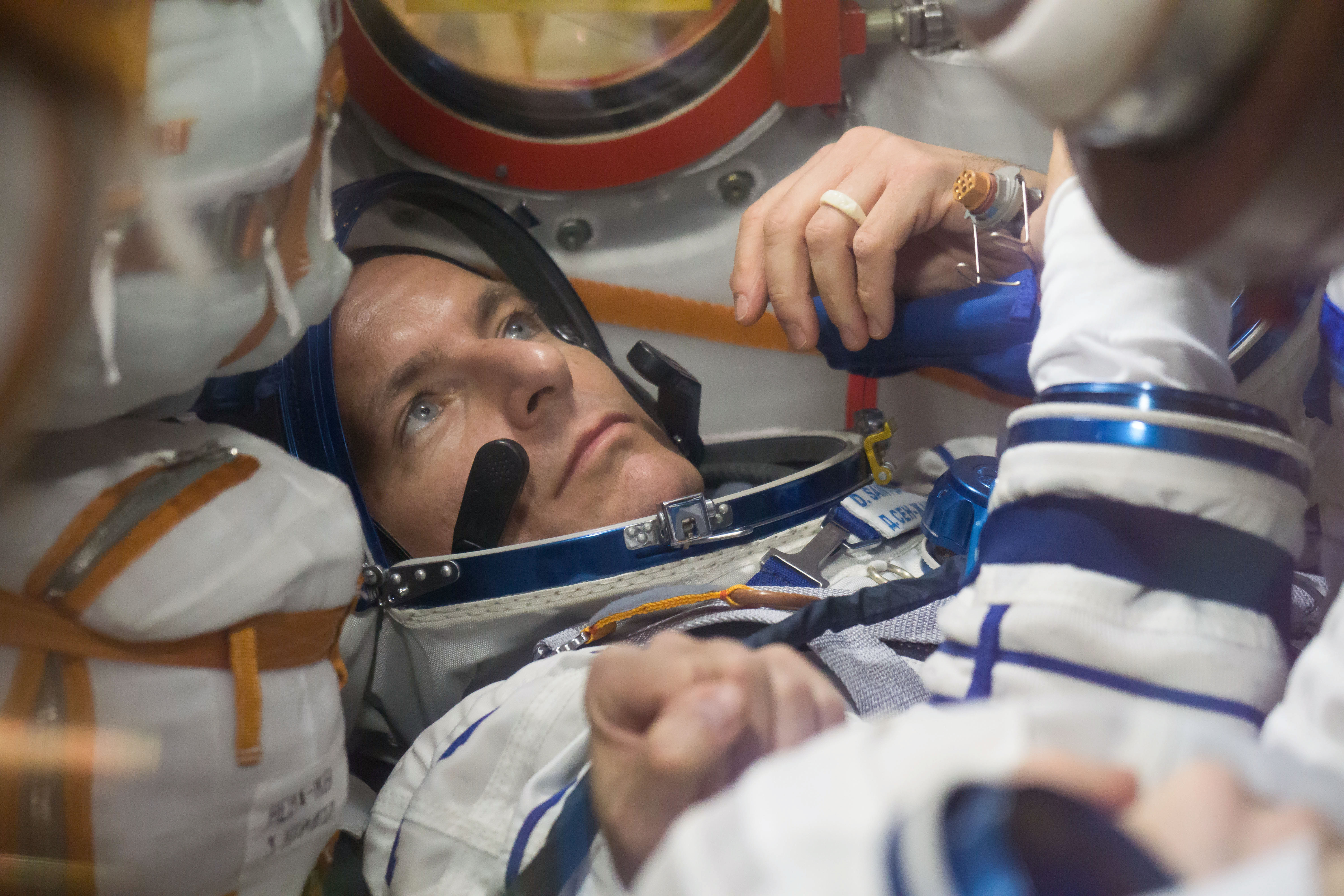 Astronaut David-Saint Jacques in the Soyuz capsule, close-up of face.