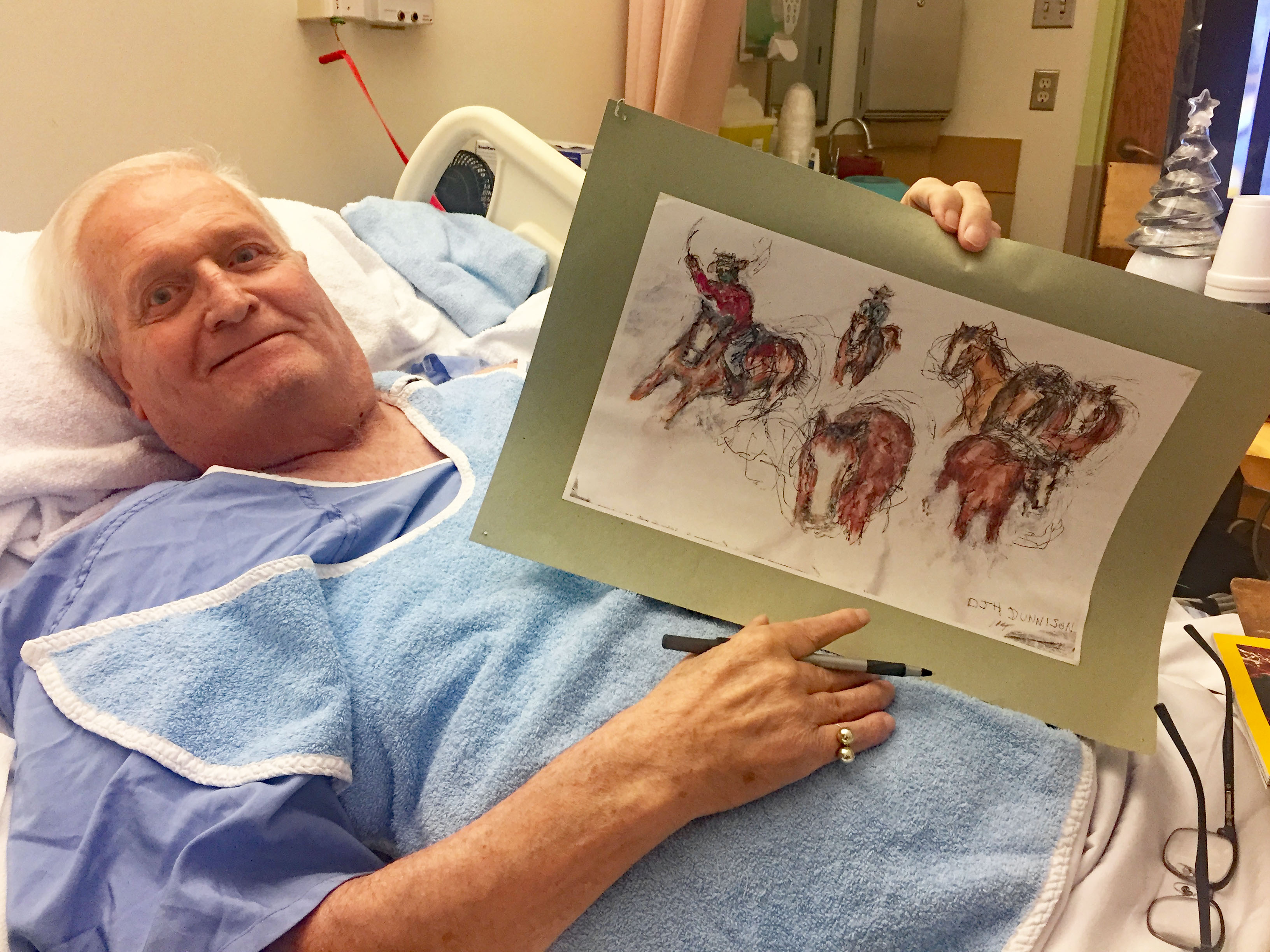 Brock Fahrni resident David Dunnison holds up the first painting he ever did with the Artworks program.