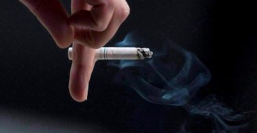 person smokes a cigarette in downtown Ottawa on Sept. 29, 2009. THE CANADIAN PRESS/Pawel Dwulit/NEWS1130.
