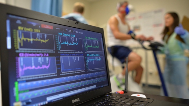 A laptop computer monitors a patient's heart function as he takes a stress test while riding a stationary bike in Augusta, Ga. on Aug. 27, 2014. (AP Photo/The Augusta Chronicle, Michael Holahan)