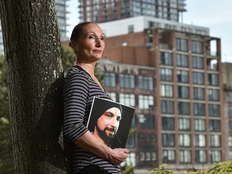 Sia Kaskamanidis with a photo of her late brother Saki Kaskas, whose original album Theodosius will be posthumously released on June 28 at the ANZA Club. (Photo courtesy of Dan Toulgoet/ Vancouver Courier)