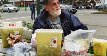 Charles Bafford, who lives in a modular housing building at Main and Terminal, spends his days picking up discarded needles in Vancouver. Photo by Dan Toulgoet/Vancouver Courier