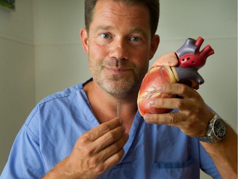 Dr. David Wood with stent and model of heart at Vancouver General Hospital. Photo: Arlen Redekop/Postmedia ARLEN REDEKOP / PNG