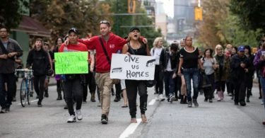 Protesters march for affordable housing on Vancouver's Downtown Eastside in August. Many protesters were living in a homeless camp at Oppenheimer Park where drug use was rampant. (Photo Credit: Maggie MacPherson/CBC)