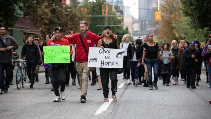 Protesters march for affordable housing on Vancouver's Downtown Eastside in August. Many protesters were living in a homeless camp at Oppenheimer Park where drug use was rampant. (Photo Credit: Maggie MacPherson/CBC)