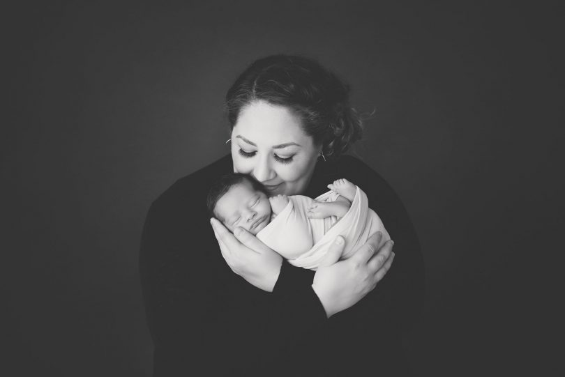 Lindsey Walshe, a new mom and a St. Paul's Hospital nurse holds her baby boy, Grayson. ( Photo courtesy of Lindsey Walshe; Photographer: Amanda Dams. )