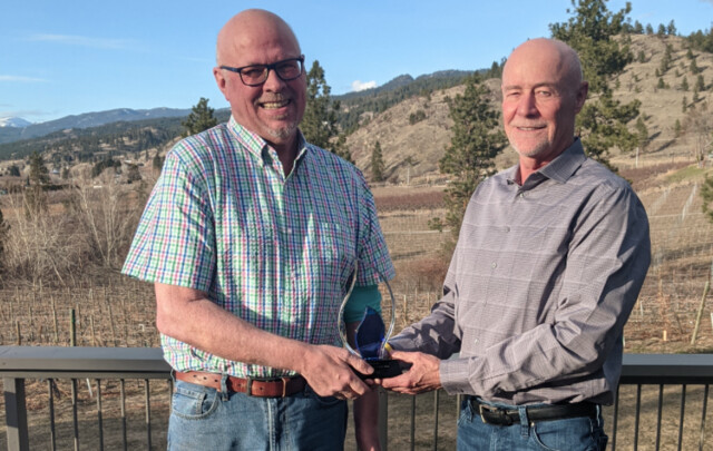 Dr. Jeff Harries, left, with his award and brother, Bruce Harries. (Photo credit: Castanet.net)