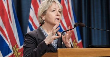 Dr. Bonnie Henry at the podium in this file photo from March 1, 2021. (Photo credit: Vancouver Sun)