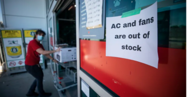 A Canadian Tire store in Vancouver posted a sign advising customers it was sold out of air conditioning units and fans on Monday amid the 'heat dome' that's breaking weather records. (Photo credit: CBC News)