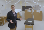 Josh Chipperfield stands inside a mocked-up hospital operating room.
